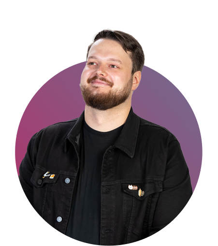 Photo of Dominik in front of purple background